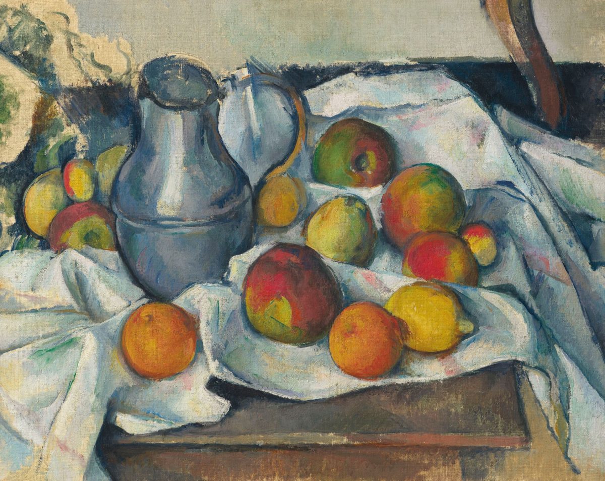Bouilloire et fruits - Paul Cézanne. A selection of fruits sit besides a water pitcher on top of a white table cloth. 