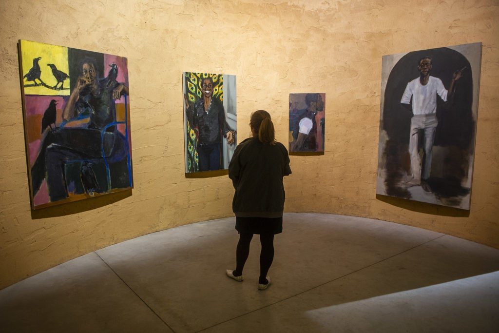 A visitor looks at an installation by Lynette Yiadom-Boakye in the Ghana Pavillion at the Arsenale during the 58th International Art Biennale on May 07, 2019 in Venice, Italy.