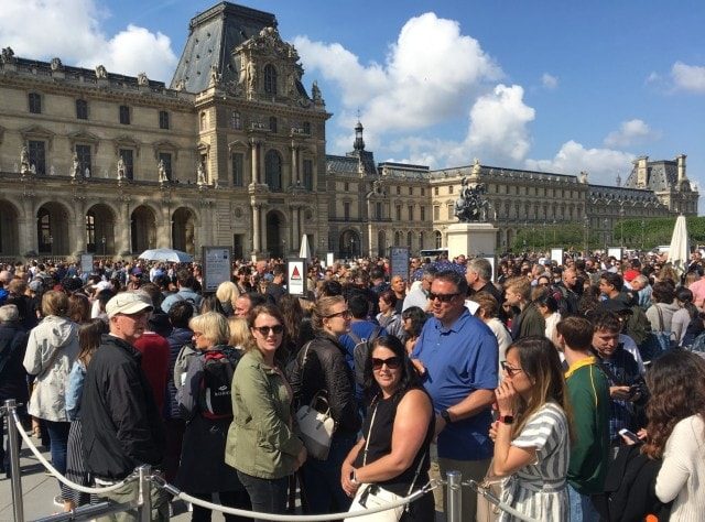 Long lines form outside the Louvre as it remains closed due to workers strike. 