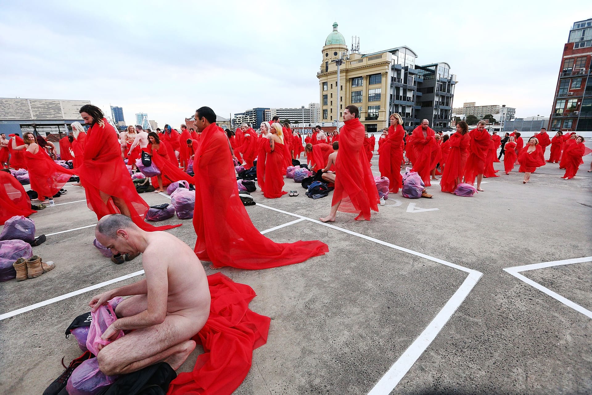 Participants finish posing as part of Spencer Tunick's nude art installation Return of the Nude on July 9, 2018 in Melbourne, Australia.