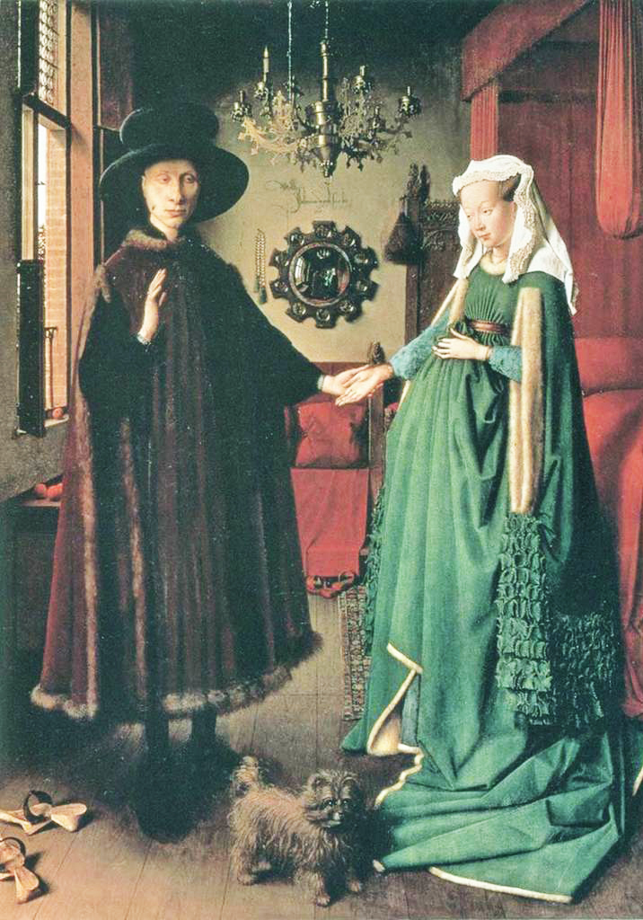 In the room in which the Arnolfini are portrayed there is an elaborate mirror at the bottom of the room. In particular, if - looking carefully - it is possible to see two figures reflected in the mirror.