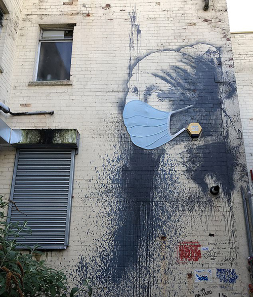 A blue mask appeared on the face of The Girl with the Pierced Eardrum on the night of 21-22 April. It is not known who touched up the murals. To date, the mystery artist has not yet claimed this interesting transformation.